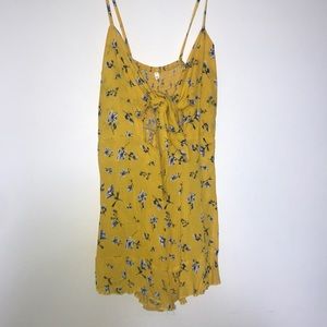 Yellow romper with blue flowers